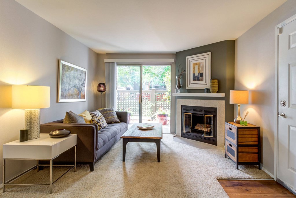 a living room with a couch and a fireplace