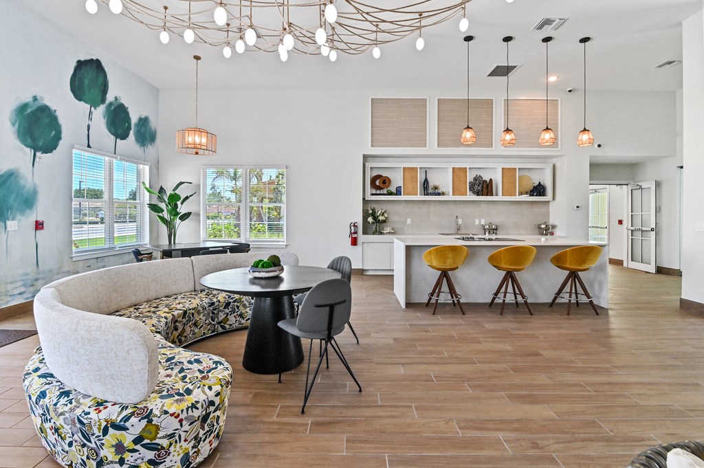 a living room with a couch and a table with chairs