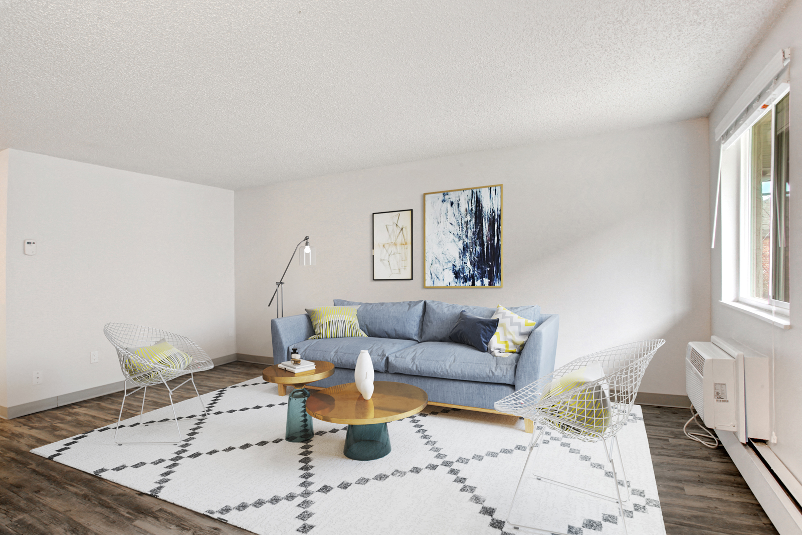 A living room with a grey couch and a coffee table.