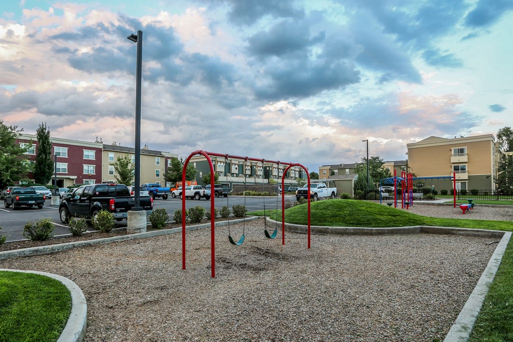 a playground in the middle of a parking lot