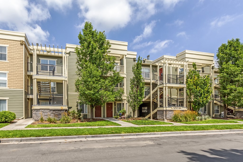 a row of apartment buildings on a city street