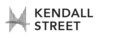 Kendall street sign on a black background.