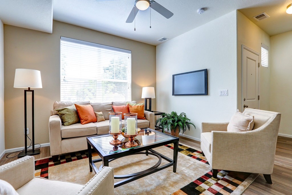 a living room with couches chairs and a coffee table
