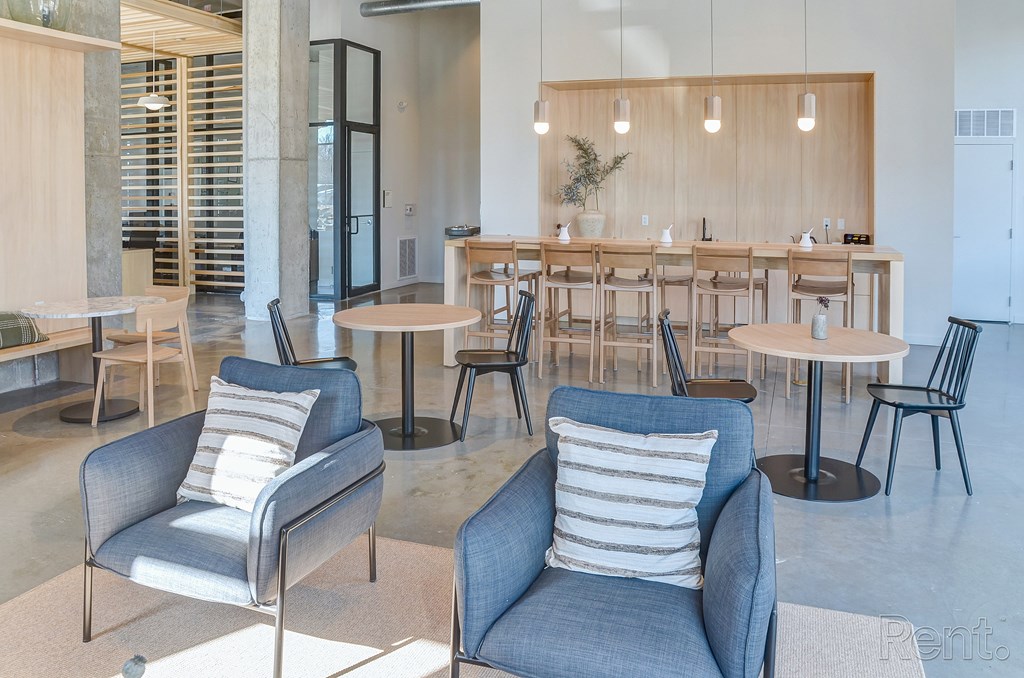 A room with a long table and chairs at The Anthem at Square 10 Apartments, New Haven, Connecticut