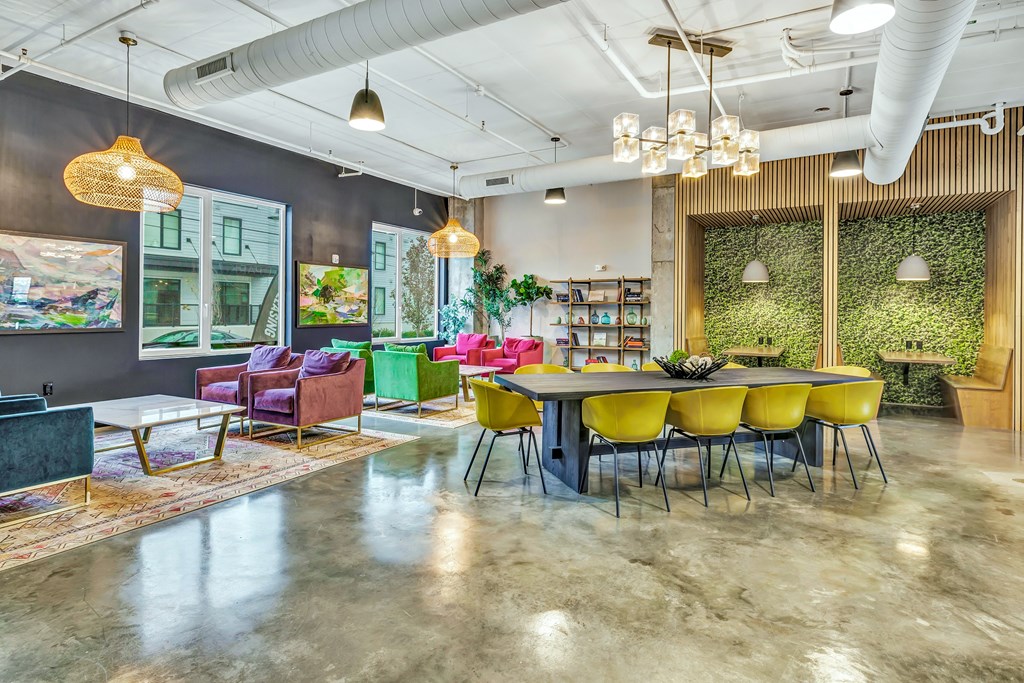 a dining room with a table and chairs in a lobby