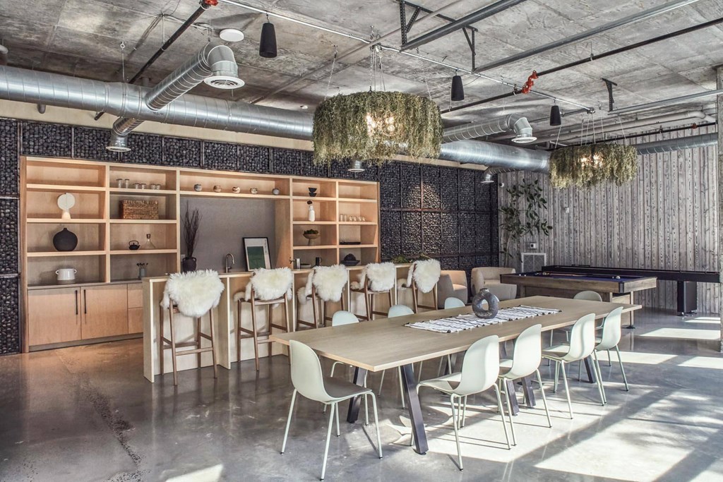 A conference room with a long table and chairs at The Anthem at Square 10 Apartments, New Haven, Connecticut