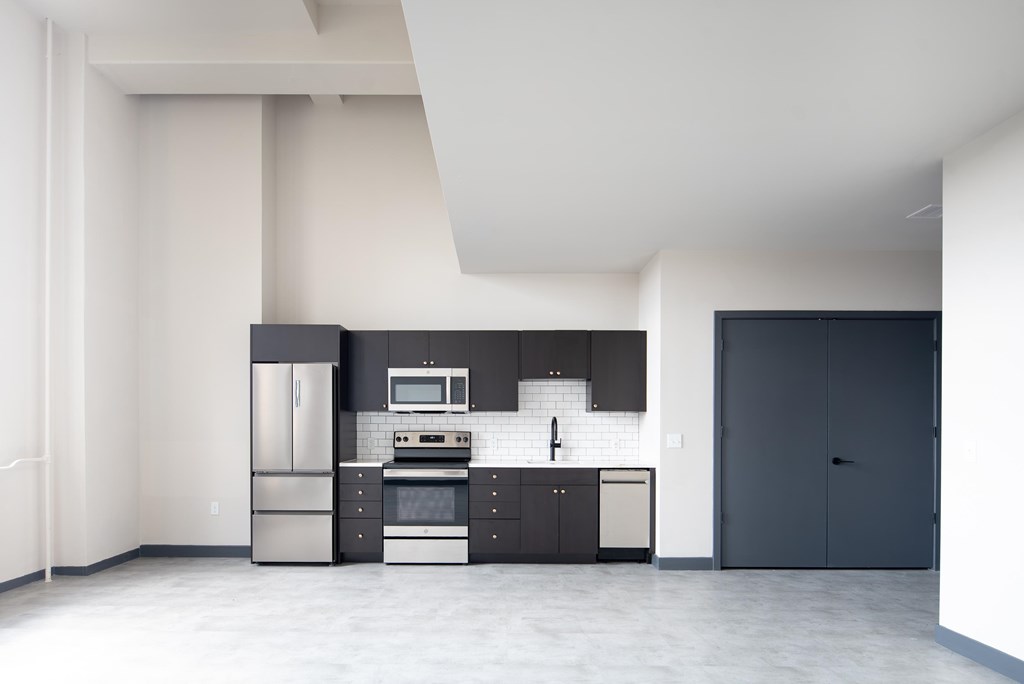 A modern kitchen with a black and white color scheme.