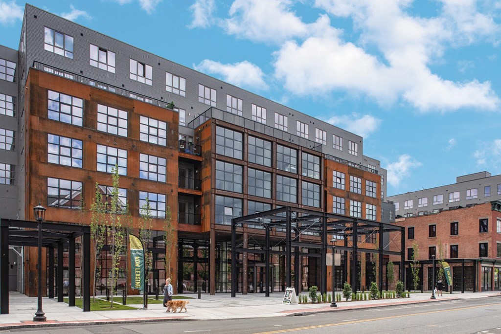 a rendering of a building on a city street