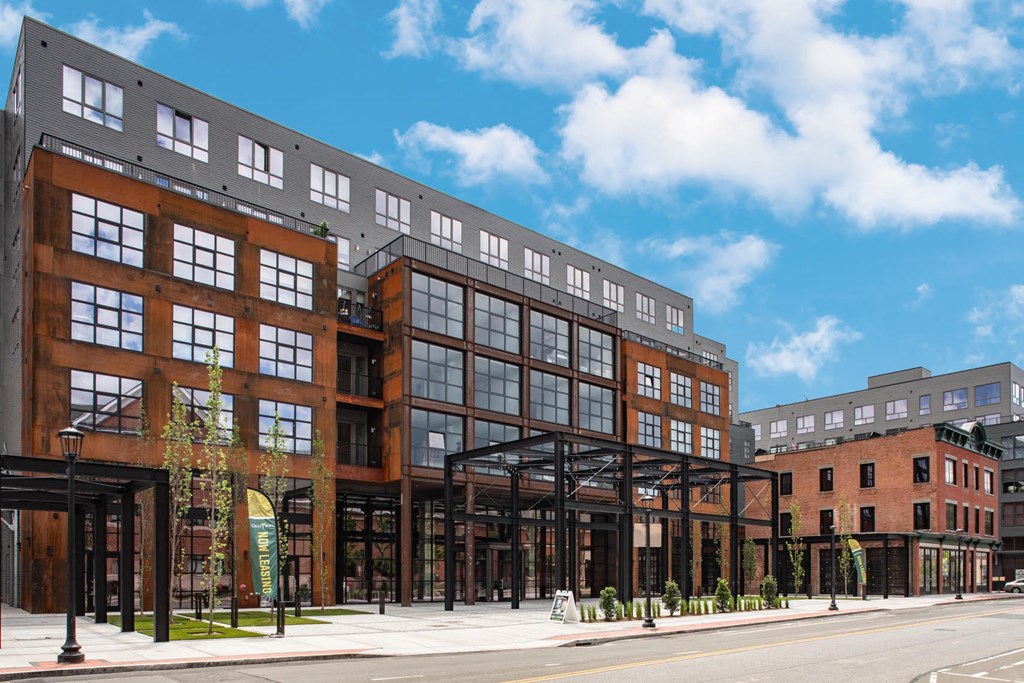 a rendering of a building on a city street