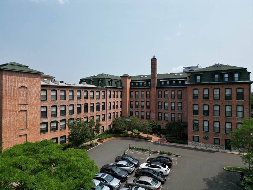 a large brick building with a chimney on top a large brick building with a chimney on top at The Corset Factory, Connecticut, 06854 - Photo Gallery