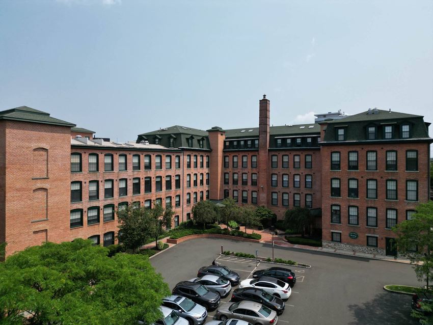 a large brick building with a chimney in the background  at The Corset Factory, Connecticut - Photo Gallery 1