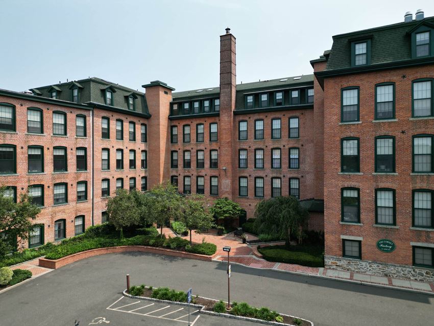 a large brick building with a chimney on top a large brick building with a chimney on top at The Corset Factory, Norwalk, 06854 - Photo Gallery