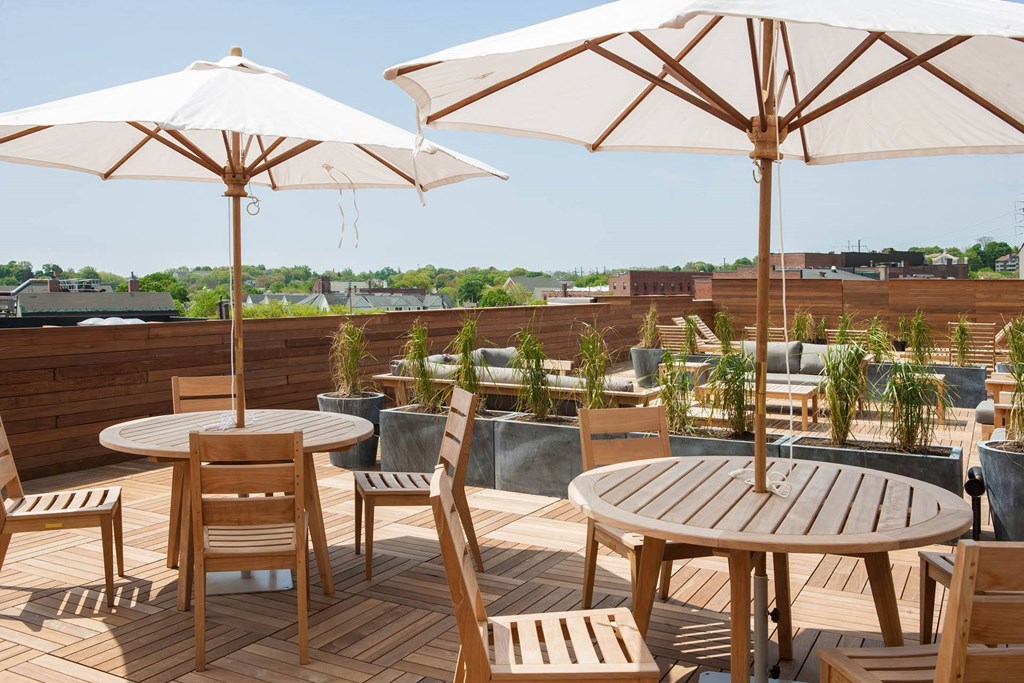 	 Rooftop patio with tables at Iron Works Sono, Norwalk, CT