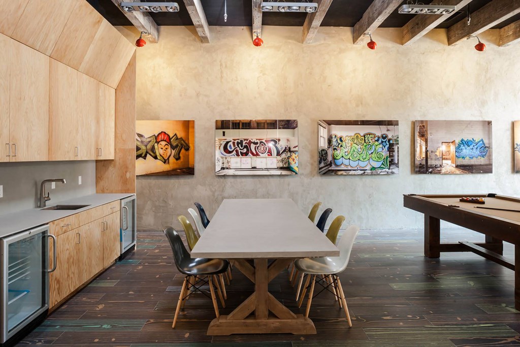 Dining area with a table and chairs and art on the walls  at Iron Works Sono, Connecticut