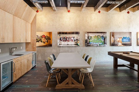 Dinning area Dining area with a table and chairs and art on the walls at Iron Works Sono, Connecticut