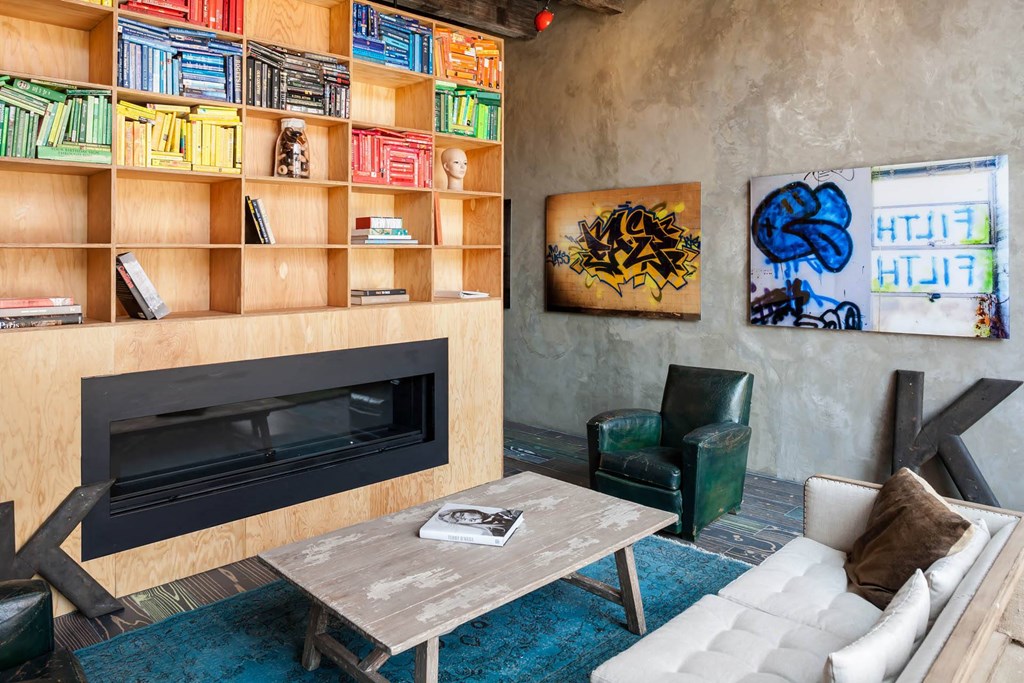 Living room with fireplace at Iron Works Sono, Norwalk