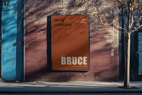 A large orange sign on a brick wall advertises "The Bruce Sono Station" as a new leasing opportunity.