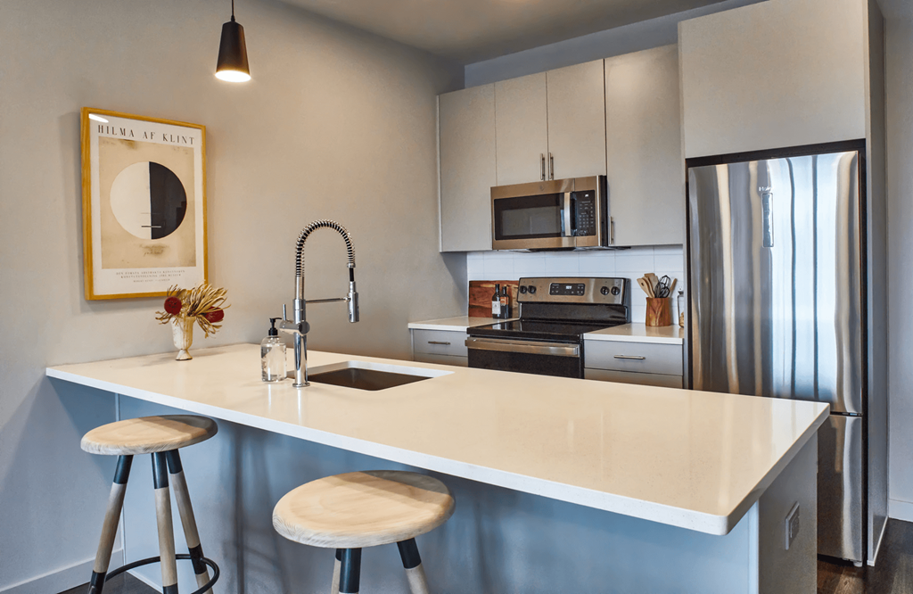 Kitchen with island Kitchen with a large island at Sono Central Residential, Norwalk, CT