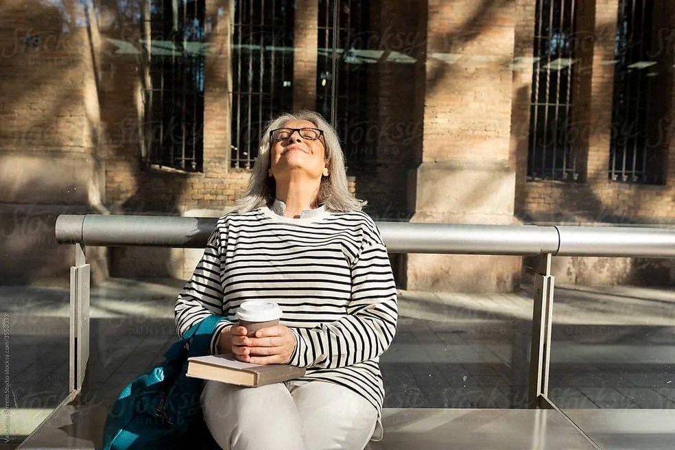 Woman With Coffee And Book at Sono Central Residential, Norwalk