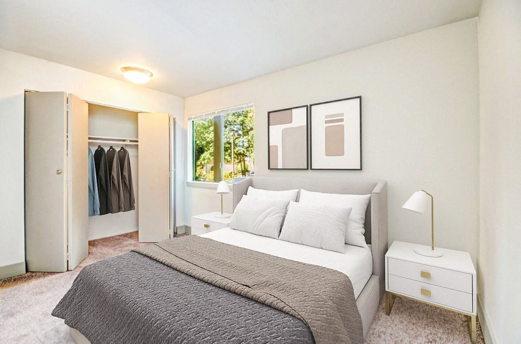 a bedroom with a bed and a closet at Autumn Village, Milton, WA