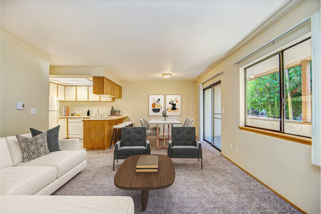 A living room with a white couch and a brown coffee table. at Autumn Village, Washington, 98354