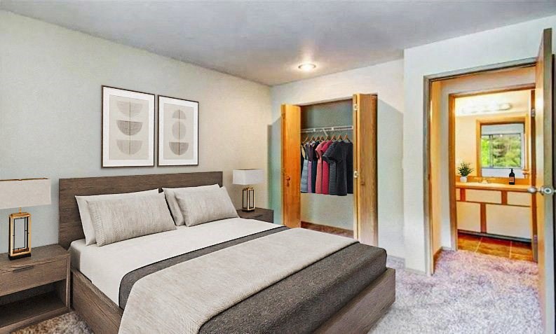 a bedroom with a bed and a closet at Autumn Village, Milton, WA