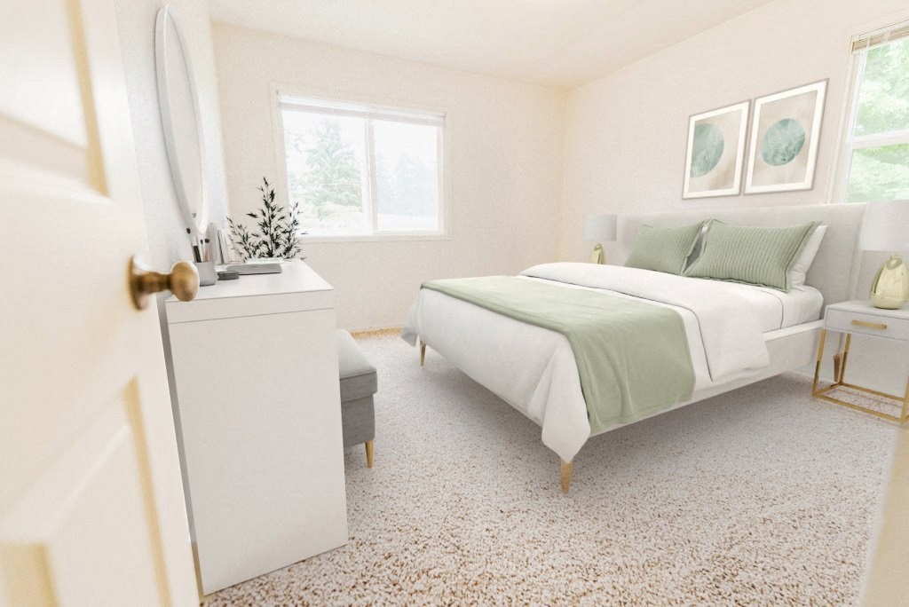 a bedroom with a white bed and green blanket