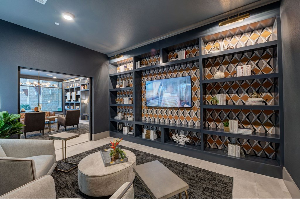 a living room with furniture and a television at Scottsdale Grand, Scottsdale, AZ, 85260