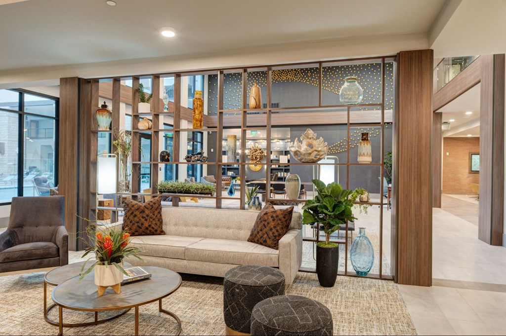 a living room with a couch and tables at Scottsdale Grand, Scottsdale