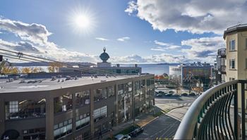 A modern building with a glass facade is the main focus of the image.