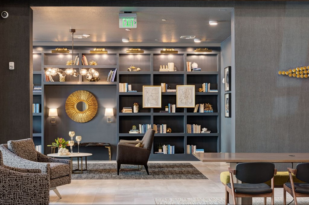 a lobby with a seating area and a book shelf at Scottsdale Grand, Arizona, 85260