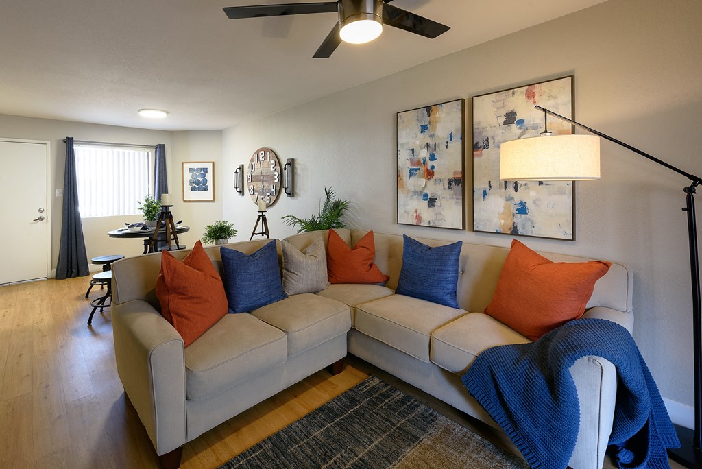 Peoria Apartments- Moxi Apartments-  a living room with a couch and chairs