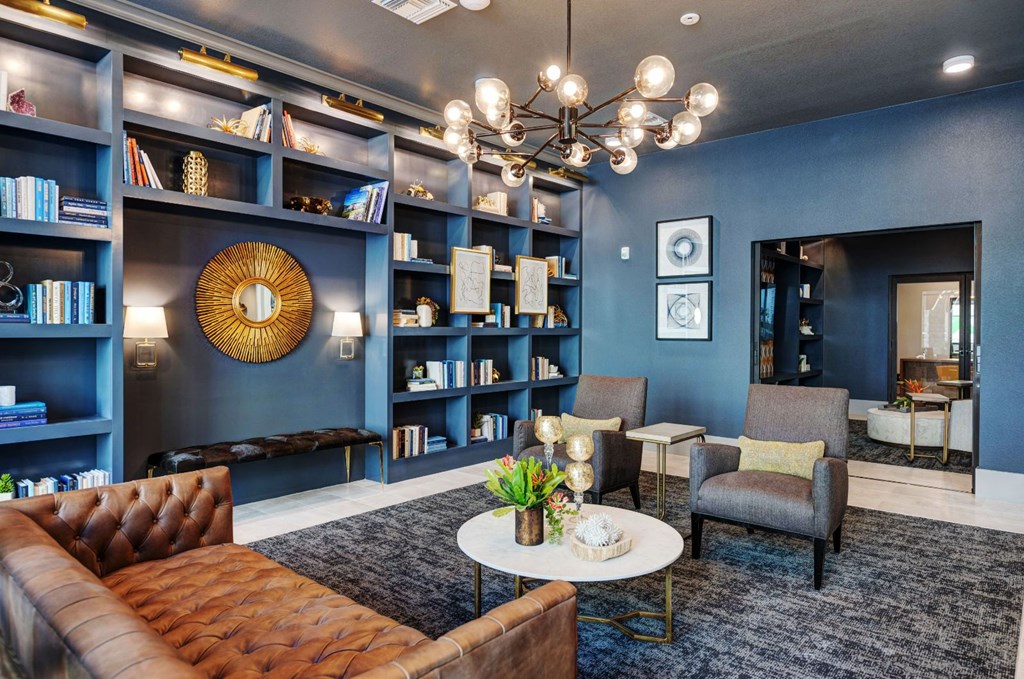 a living room with blue walls and a chandelier at Scottsdale Grand, Scottsdale, AZ