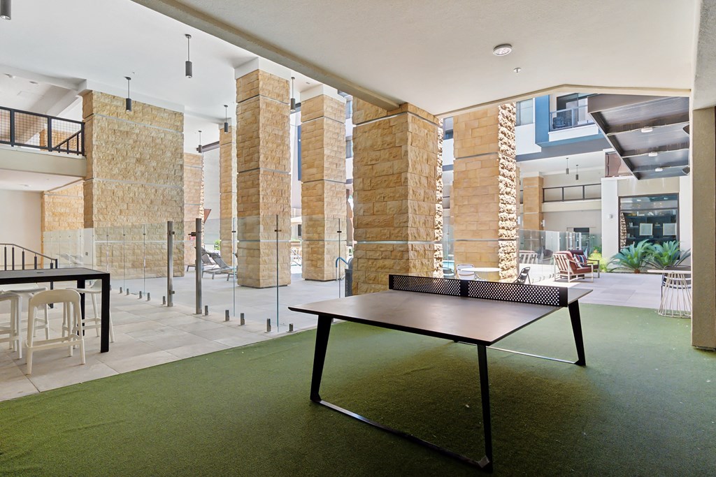 a ping pong table in the lobby of an office building