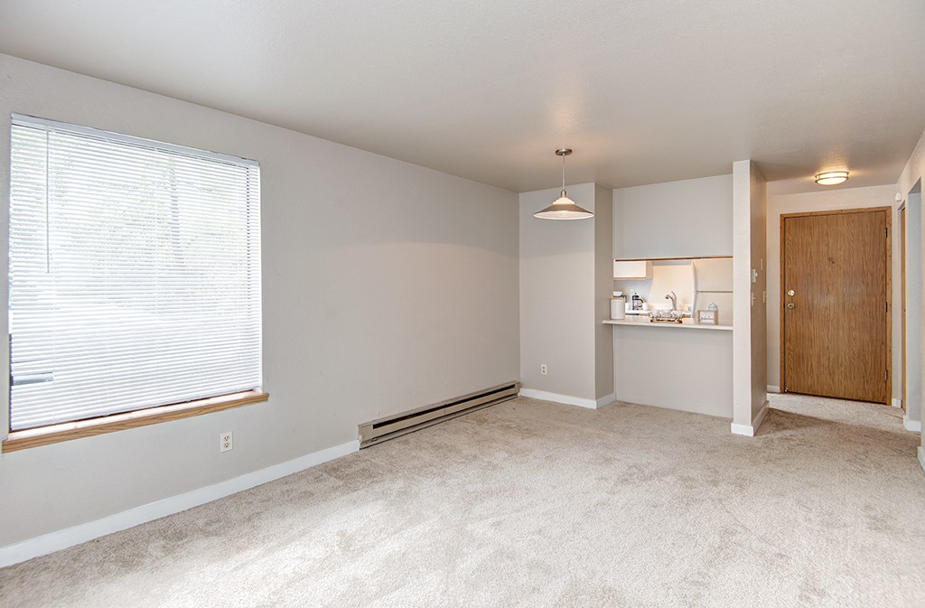 Seattle Apartments-  living area with natural light and kitchen