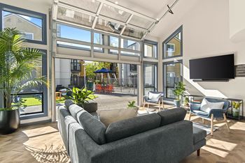 a living room with a couch and a tv