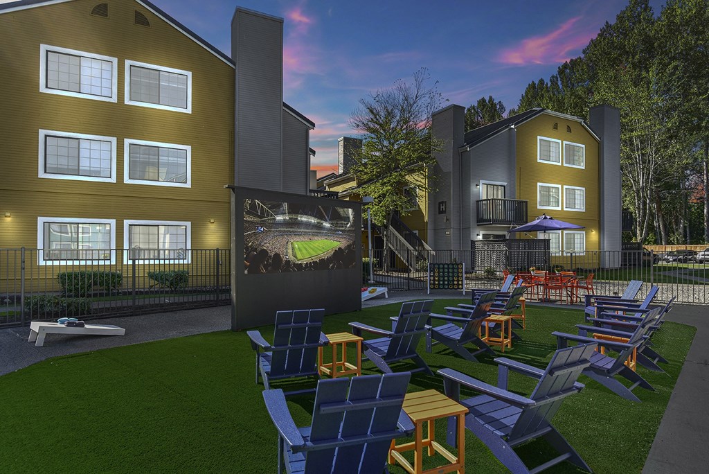 a rendering of a yard with lounge chairs and a screen