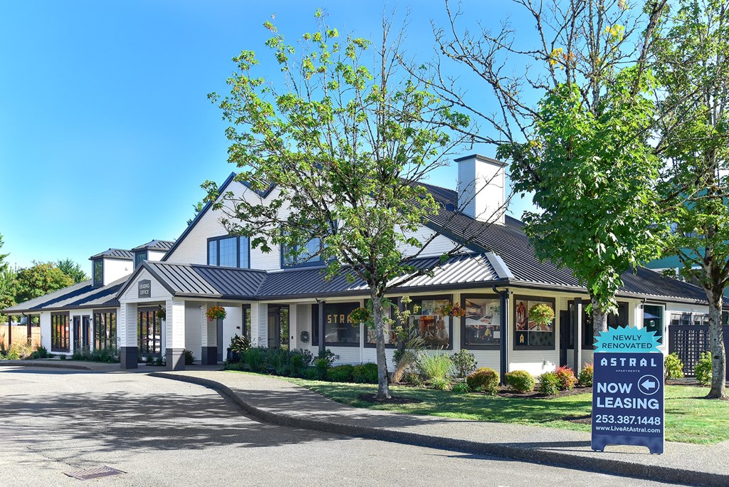 a white house with a sign in front of it