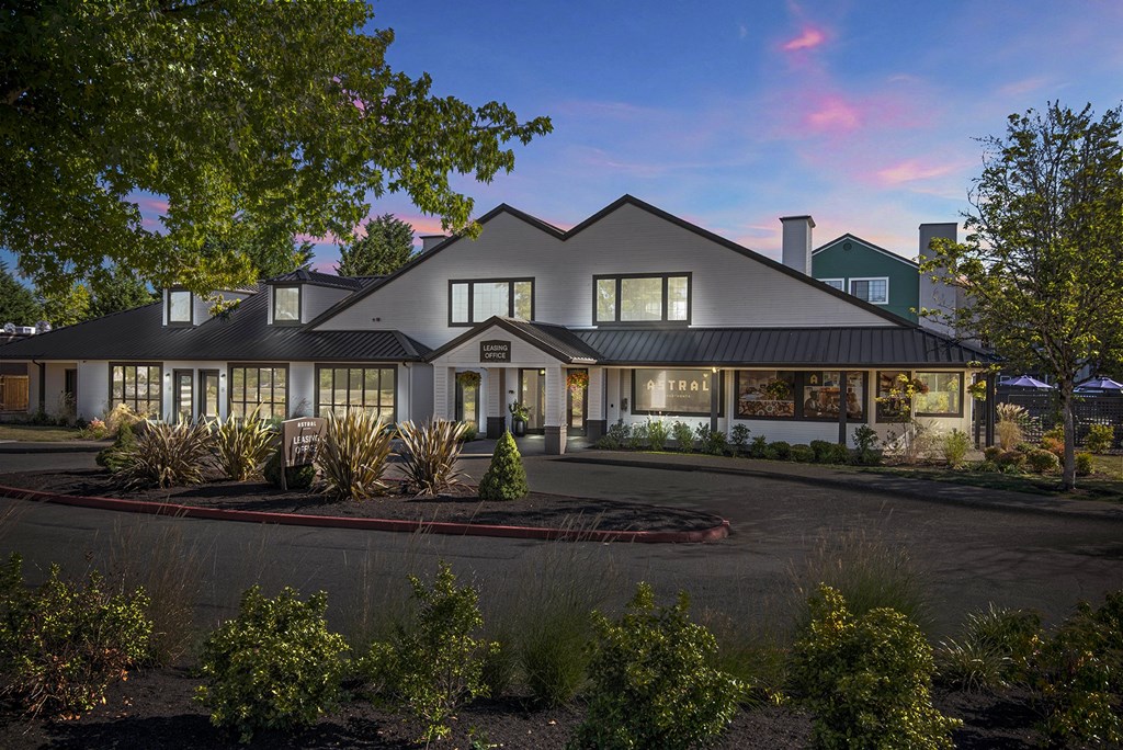 a rendering of the exterior of a house with a driveway and landscaping