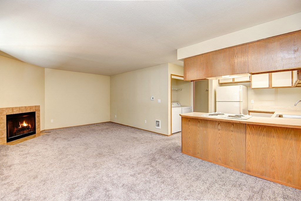 Milton Apartments - Autumn Village Apartments - Living room-kitchen bar area