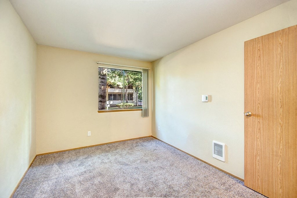 Empty room with a window and a door. at Autumn Village, Milton, WA