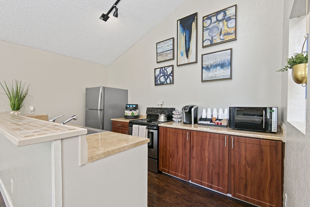 a kitchen with a stove top oven next to a sink