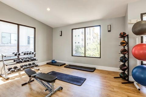 A well-equipped home gym with a variety of exercise equipment.