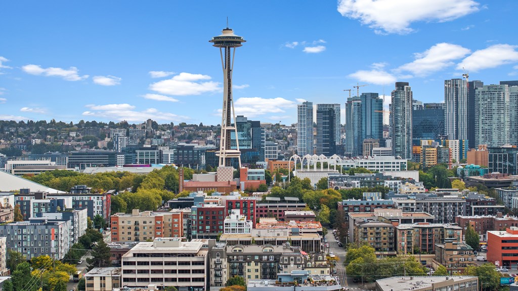 A cityscape with a tall tower in the center.