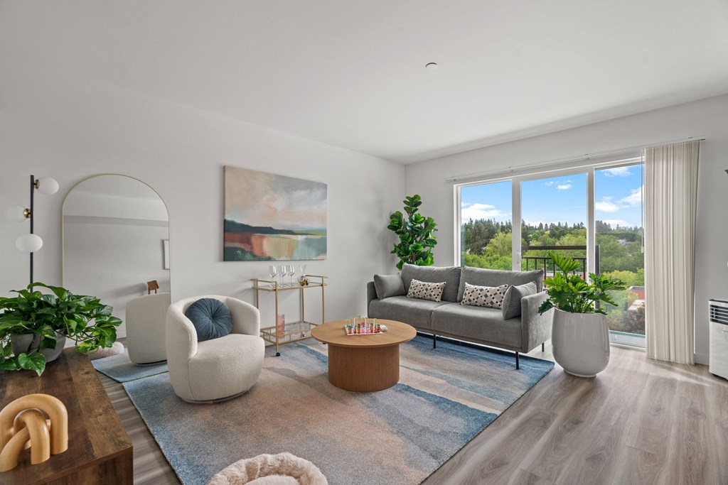 a living room with couches and chairs and a table