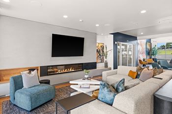 a living room with couches and chairs and a fireplace at Gage On Sixth, Washington, 98465