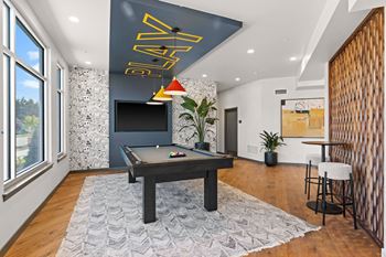 a game room with a pool table and a tv at Gage On Sixth, Tacoma, 98465