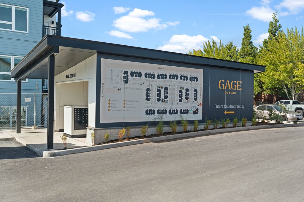 a building with a large sign on the side of a road