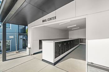 the main entrance to the hall center with a long counter with many bottles of wine at Gage On Sixth, Tacoma, WA, 98465