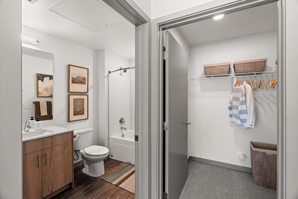 a bathroom with a shower and a toilet and a sink at Gage On Sixth, Tacoma, WA